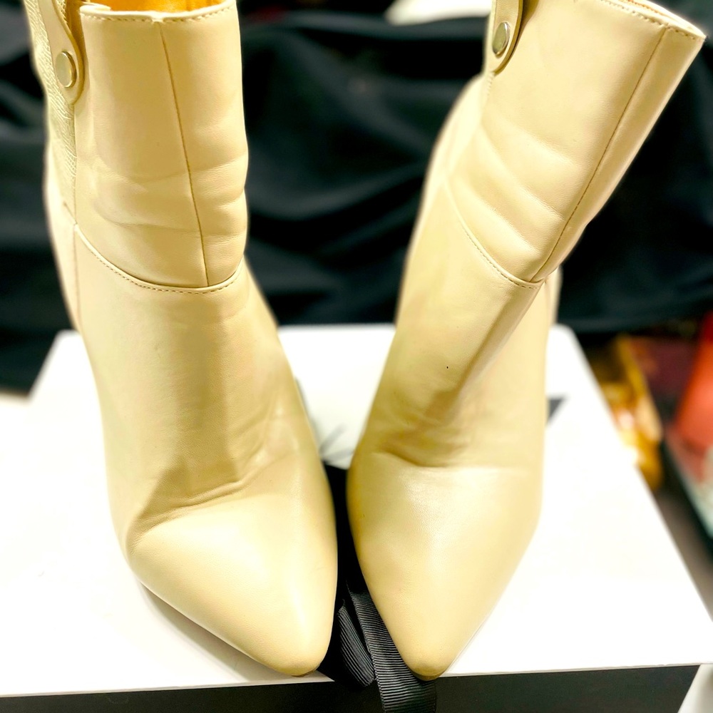 Size 8.5 cream ankle booties. Gently used.